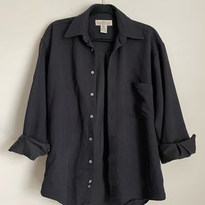 Natural Issue small black button up shirt. Fabric has a ribbed texture